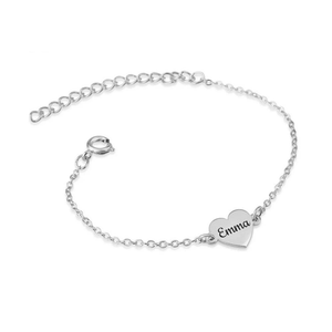 Silver bracelet with a heart-shaped tag engraved with 'Emma' on a white background