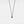 Necklace with a round pendant on a light gray background