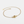 Gold bracelet with a round clasp on a light gray background