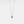 Silver necklace with a projection gemstone pendant on a light gray background