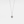 A white gold-plated sterling silver charm necklace with a teardrop-shaped pendant featuring a photo projection, suspended from a delicate chain.