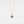 A custom photo projection necklace with a gold plating finish, featuring a circular blue charm on a chain.