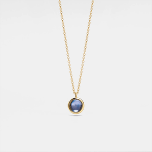 A custom photo projection necklace with a gold plating finish, featuring a circular blue charm on a chain.