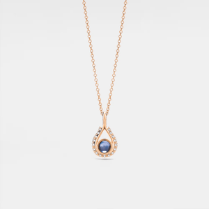 A rose gold-plated necklace with a teardrop-shaped charm featuring a projection bead and small clear stones around the edge, on a white background.