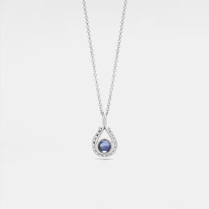 A white gold-plated necklace with a teardrop-shaped charm featuring a projection bead and small clear stones around the edge, on a white background.