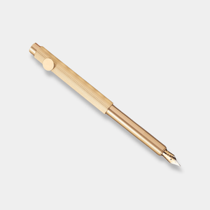 Gold pen on a light gray background