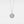 Silver necklace with a round locket pendant on a light gray background