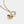 Gold necklace with a round locket shown open, featuring a smooth polished exterior and a photo insert inside on a light gray background