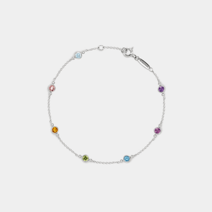Silver bracelet with colorful gemstones on a white background