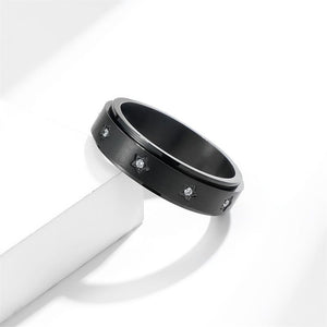 Black fidget spinner ring with star patterns and cubic zirconia embellishments.