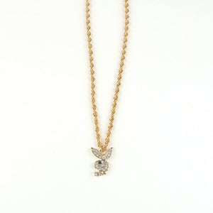 A collection of bunny pendant necklaces in silver and gold colors displayed on a stand, with adjustable chains.