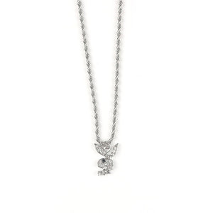 A collection of bunny pendant necklaces in silver and gold colors displayed on a stand, with adjustable chains.