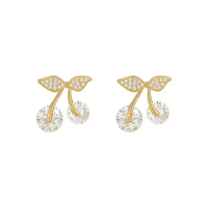 Gold bow-shaped earrings with clear gemstones on a white background