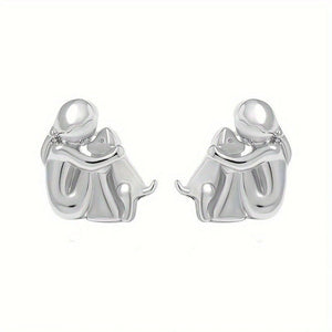 Silver elephant earrings on a white background