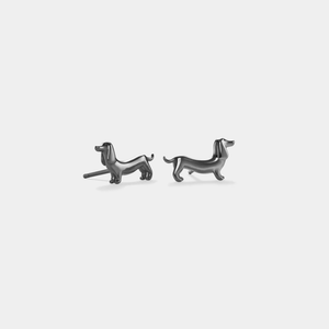 A pair of gold-plated sterling silver stud earrings in the shape of dachshund dogs.