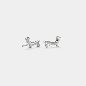 A pair of gold-plated sterling silver stud earrings in the shape of dachshund dogs.