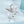 Silver bird-shaped ring on a light blue background