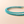 Turquoise beaded bracelets on a beige background