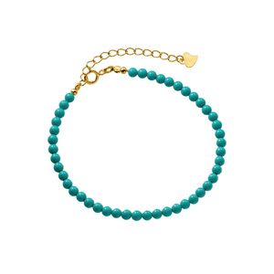 Turquoise beaded bracelet with gold clasp on a white background