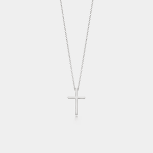 Silver cross necklace on a light gray background