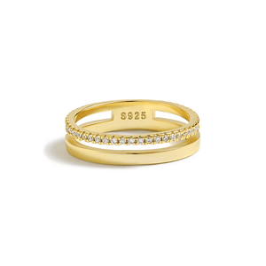 Gold ring with diamond accents on a white background