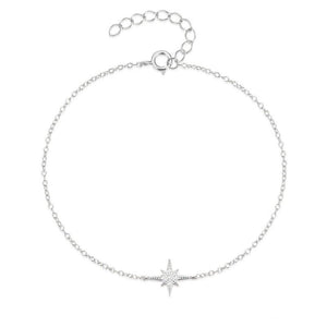 Silver bracelet with a star-shaped charm on a white background