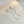 Silver hairpin with floral design on a light background