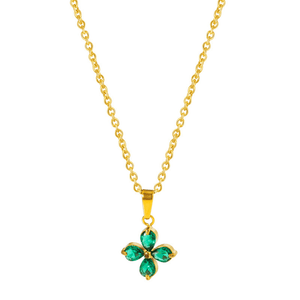 Gold necklace with a green flower pendant on a white background