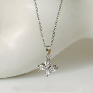 Silver necklace with a butterfly-shaped pendant on a white background