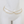 Gold necklace with small beads on a mannequin head against a white background