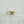 Gold ring with small diamonds on a light gray background