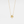 Gold necklace with a four-leaf clover pendant on a light gray background