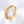 Gold star ring with cubic zirconia accents on a white background