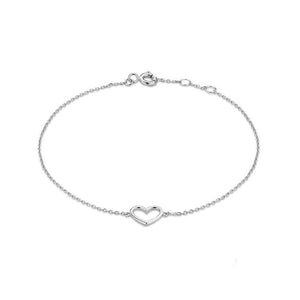 A gold-plated sterling silver bracelet with a heart charm, displayed on a person's wrist.