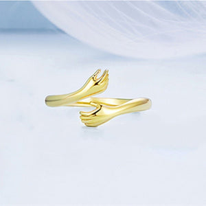 A set of three dainty stacking rings in silver, gold, and rose gold colors, displayed against a light background.