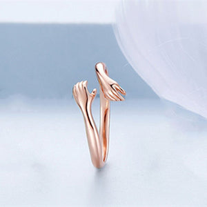 A set of three dainty stacking rings in silver, gold, and rose gold colors, displayed against a light background.