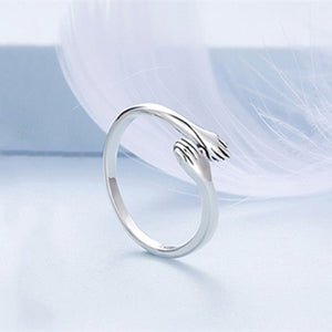 A set of three dainty stacking rings in silver, gold, and rose gold colors, displayed against a light background.