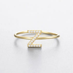 Gold bracelet with 'Z' design on a light gray background