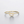 Gold ring with a letter 'G' design on a light gray background