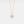Rose gold necklace with a round opal locket on a light gray background