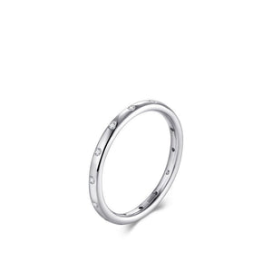 Silver ring with small diamonds on a white background