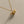 Two whale charm necklaces, one plated in silver and the other in gold, displayed against a neutral background.