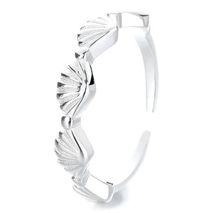 Silver bracelet with a unique design on a white background