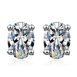 Pair of diamond stud earrings on a white background