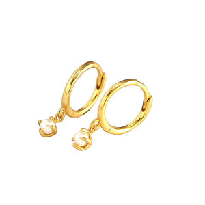 Gold hoop earrings with pearl drops on a white background