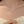 Pearl necklace on a person with a blurred background