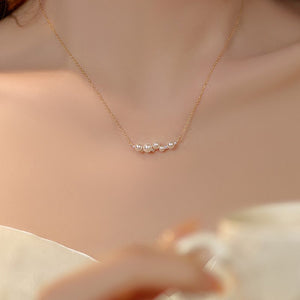 Pearl necklace on a person with a blurred background