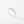 Silver ring with a pink gemstone on a light gray background