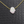 Necklace with a pink opal hamsa pendant on a textured black background
