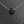Necklace with a black stone pendant on a textured gray background